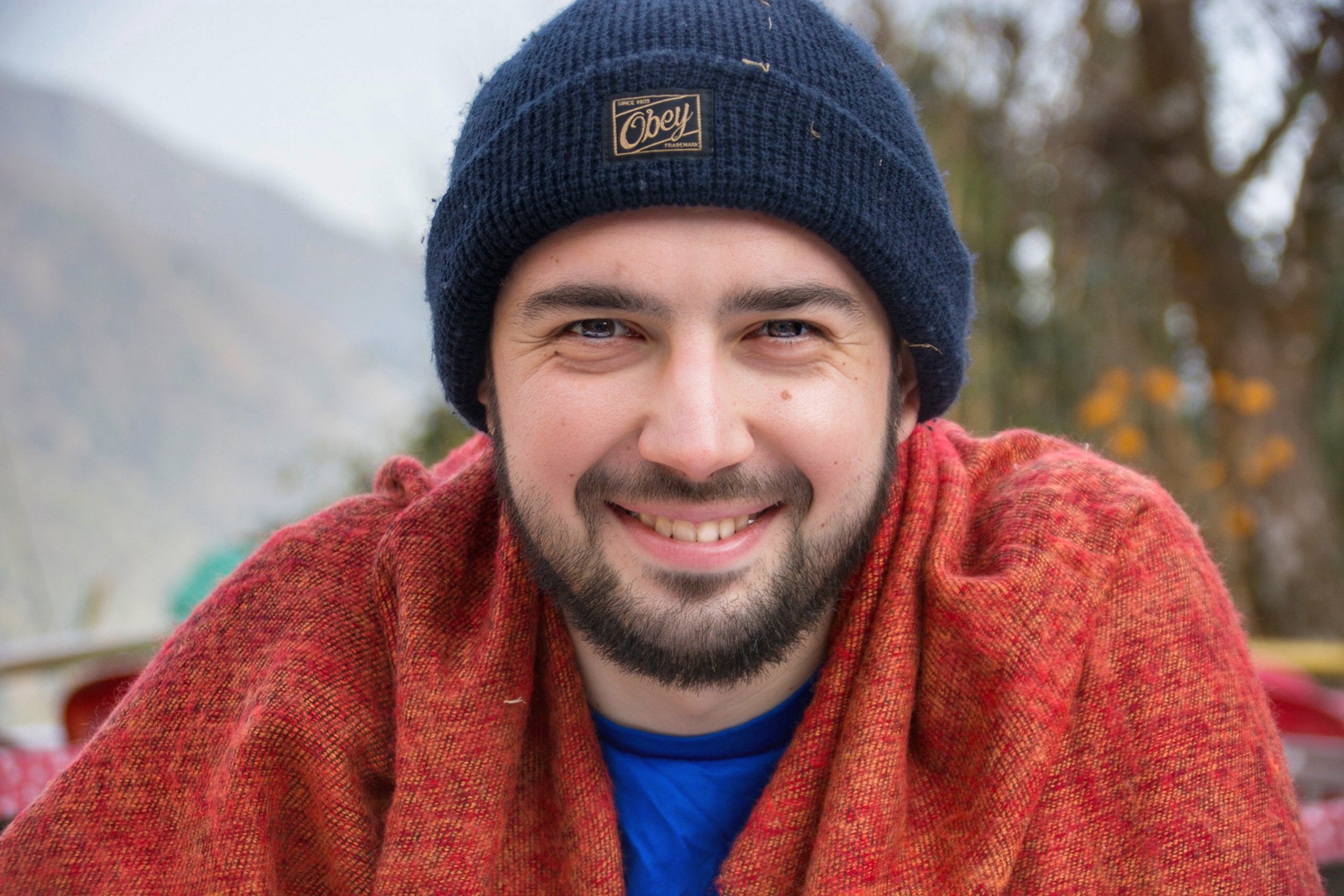 Andrey Berdichevskiy in a red shawl and blue hat